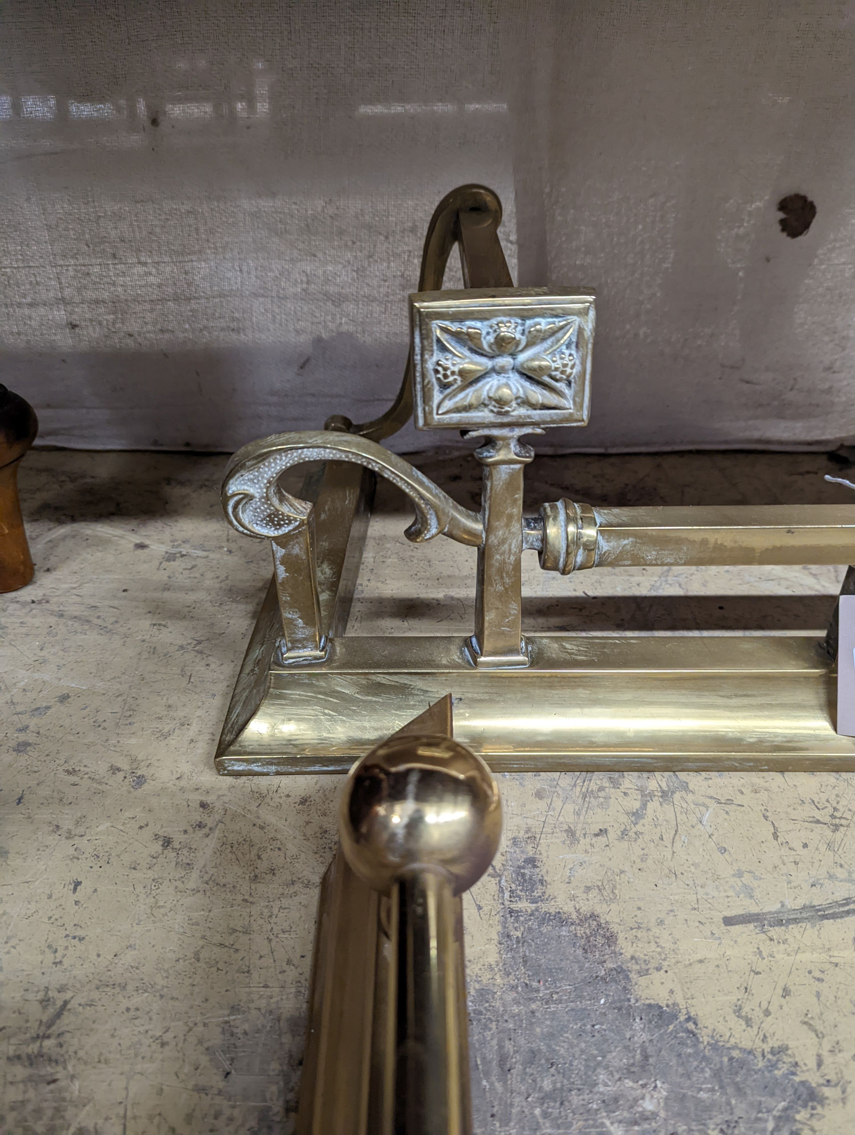 Two Edwardian and later brass fenders, one telescopic